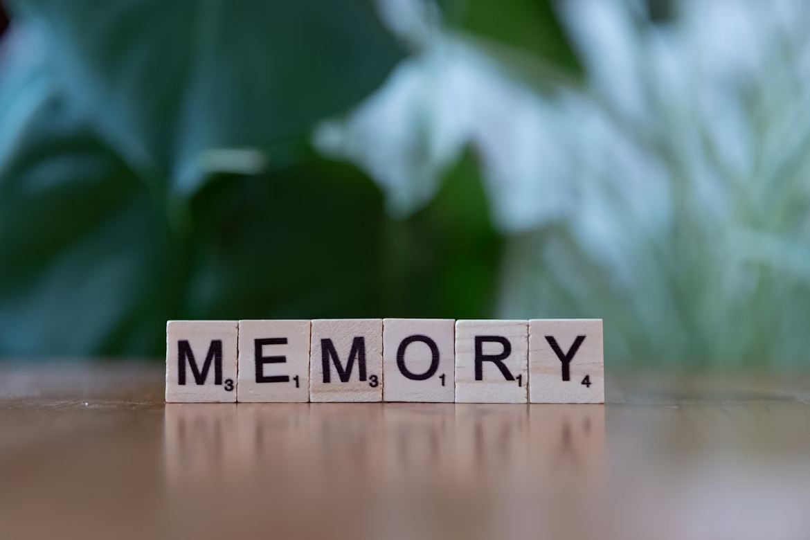 Scrabble letter tiles spelling the word memory